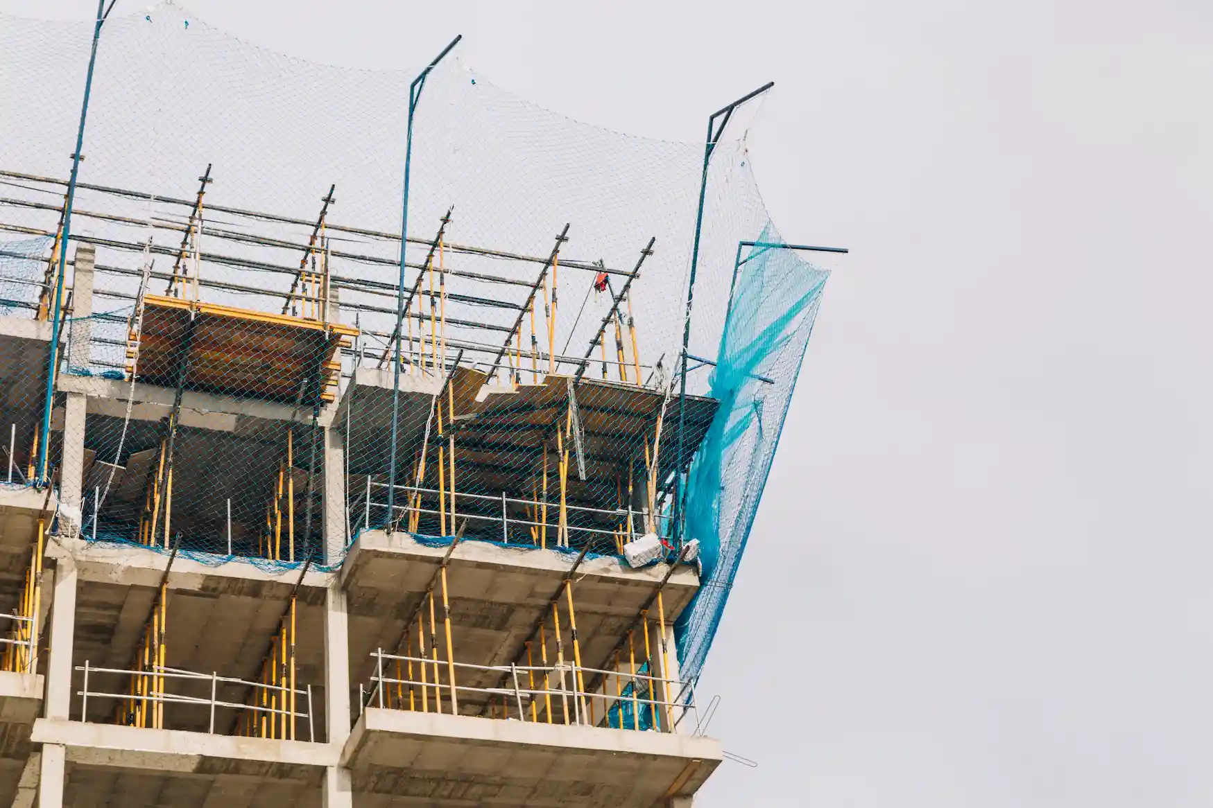Concrete building framed with secure scaffolding systems from San Diego Elite Scaffolding