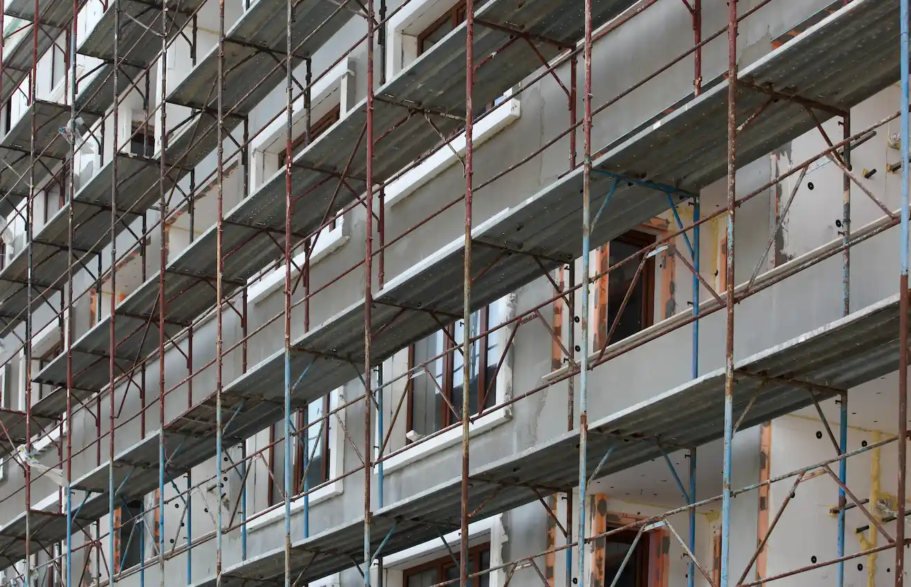 Steel and glass building supported by professional scaffolding from San Diego Elite Scaffolding